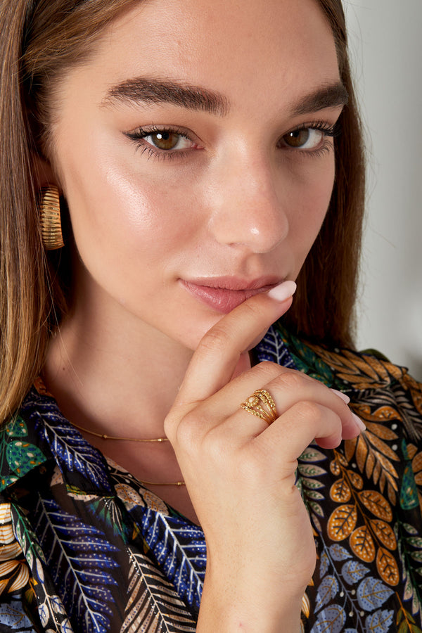 Ring four-layer with stones - gold/black/white