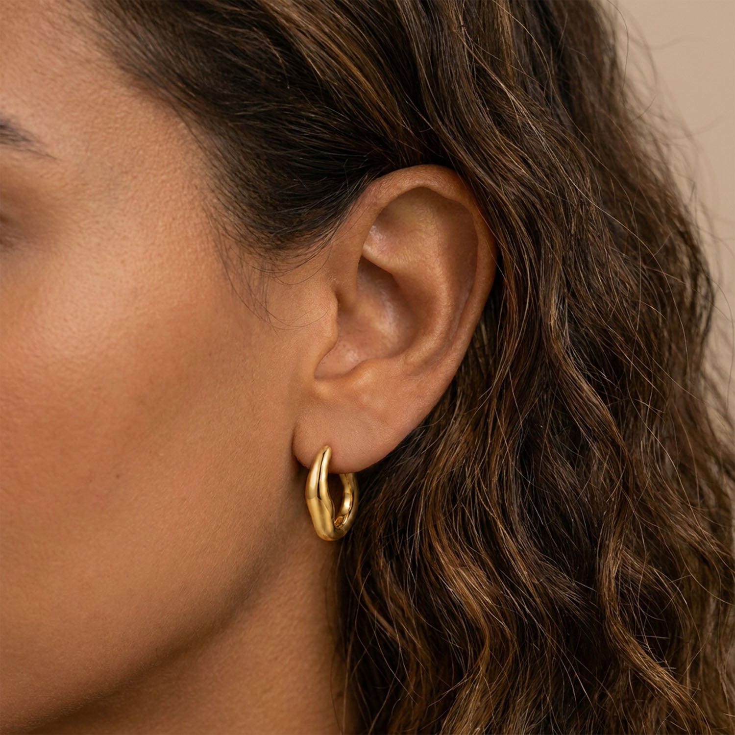 Bold wavey hoops gold