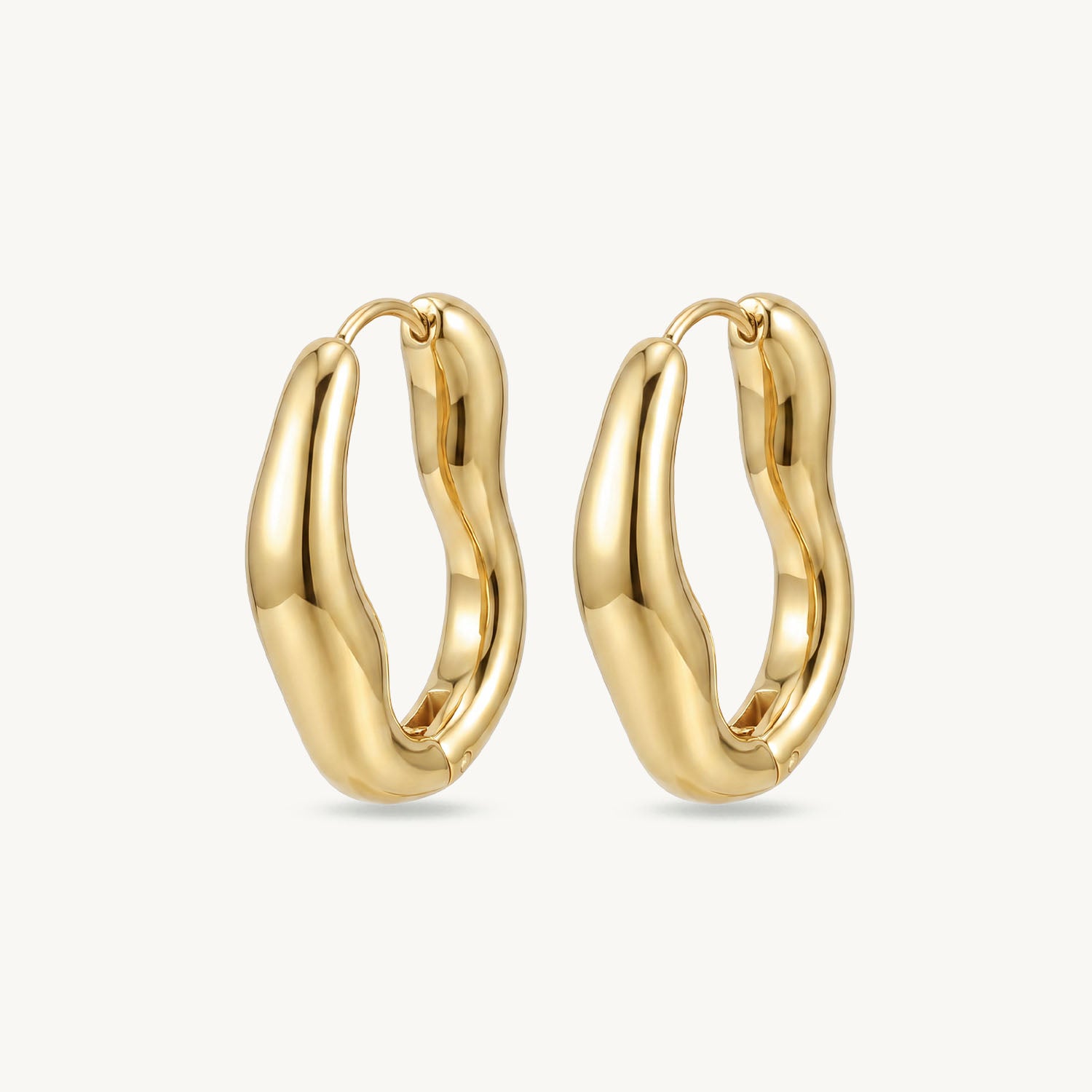 Bold wavey hoops gold